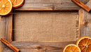 Rustic wooden frame with dried oranges and cinnamon sticks
