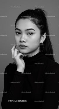 Elegant Young Woman Portrait with Hoop Earrings in Black and White
