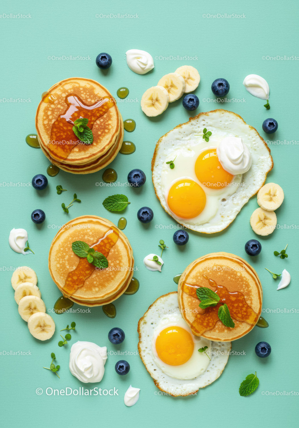 Fresh breakfast with pancakes fried eggs and fruits