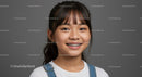 Portrait of a Happy Girl with Braces Smiling Brightly Against Grey Background