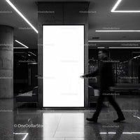 Blurred businessman walking by bright advertisement panel