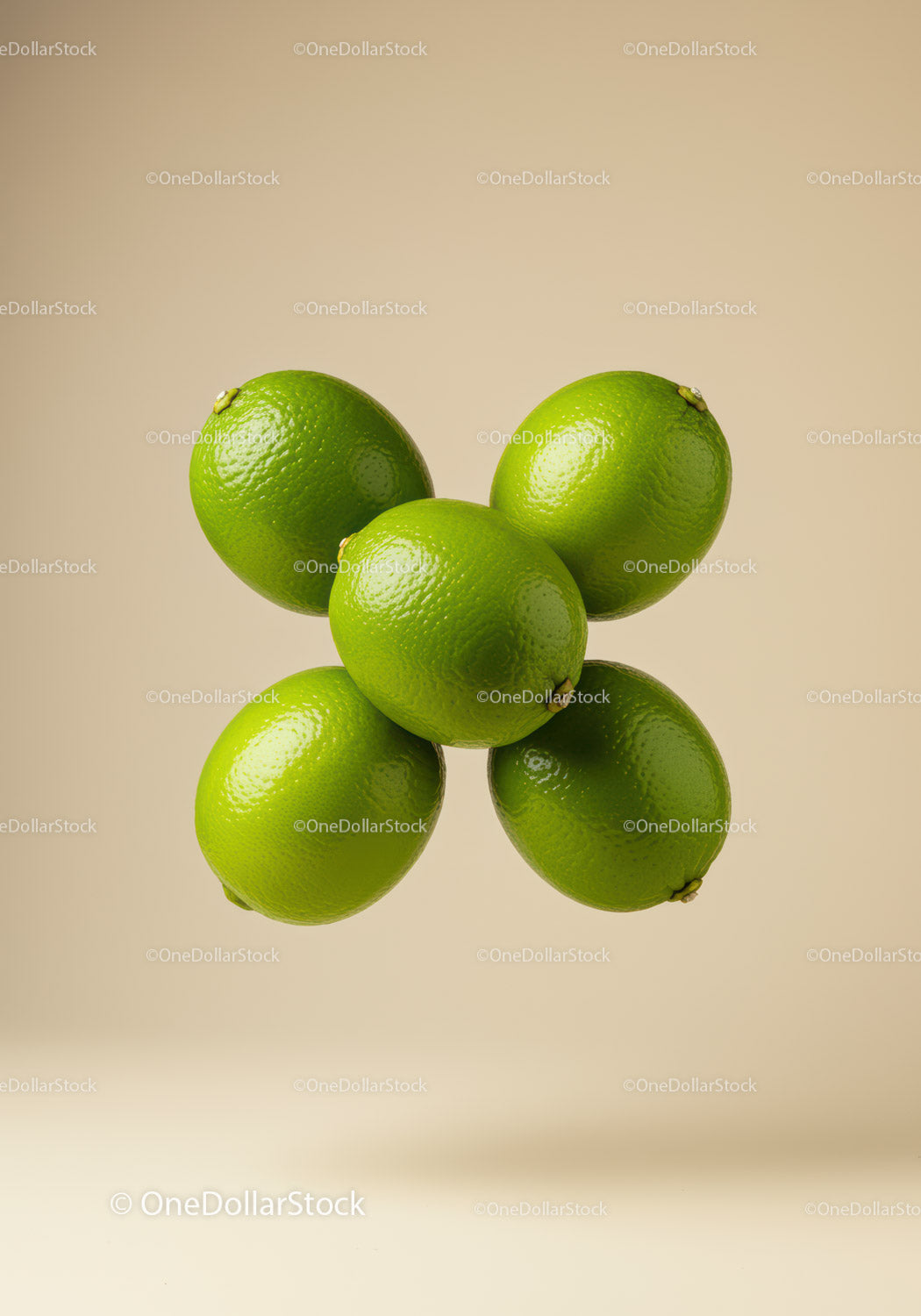 Fresh green limes floating on beige background