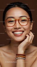 Smiling woman wearing glasses and beaded bracelets