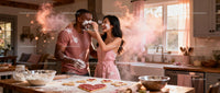 Couple Playfully Baking Heart-Shaped Cookies Together