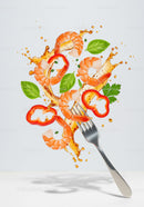 Fresh shrimp and vegetables splashing with oil on fork