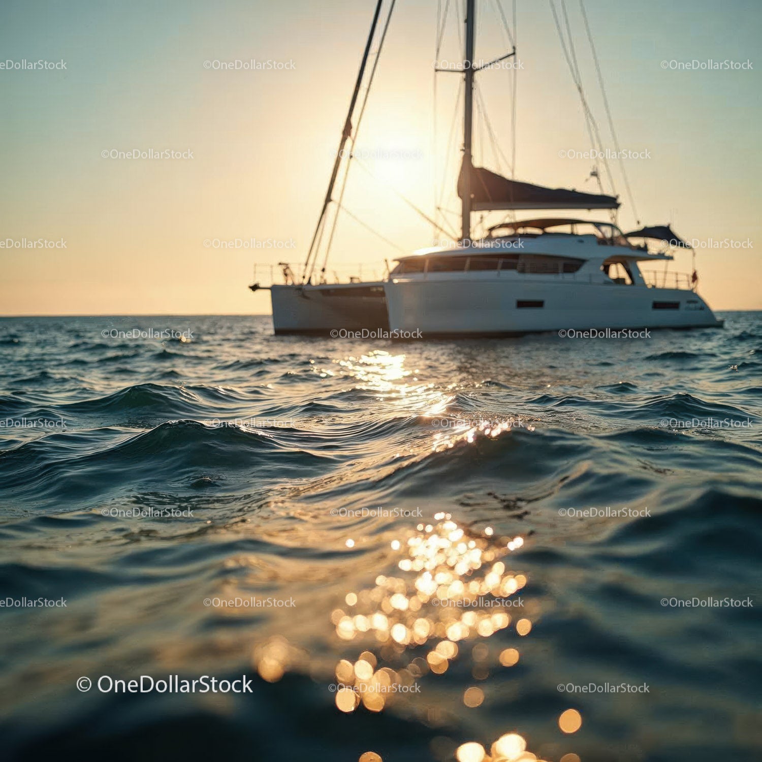Luxury Sailboat in Calm Ocean Waters During Sunset