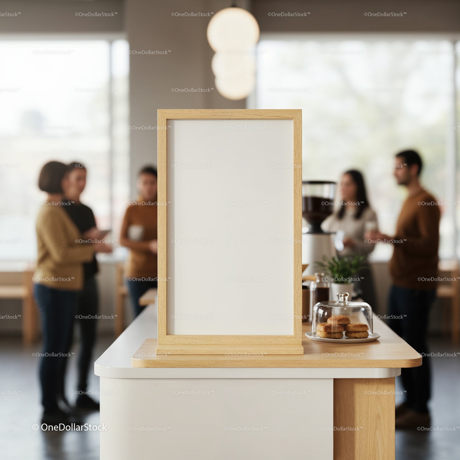 Blank wooden frame on counter in modern coffee shop