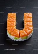 Salmon and avocado sushi arranged in U shape