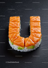 Salmon and avocado sushi arranged in U shape