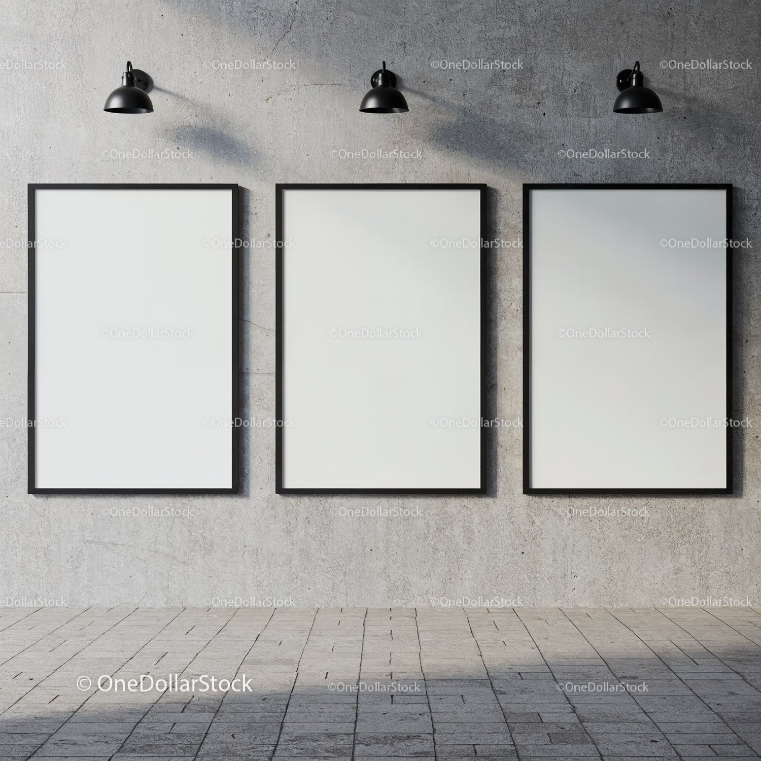 Three blank posters on concrete wall under industrial lights