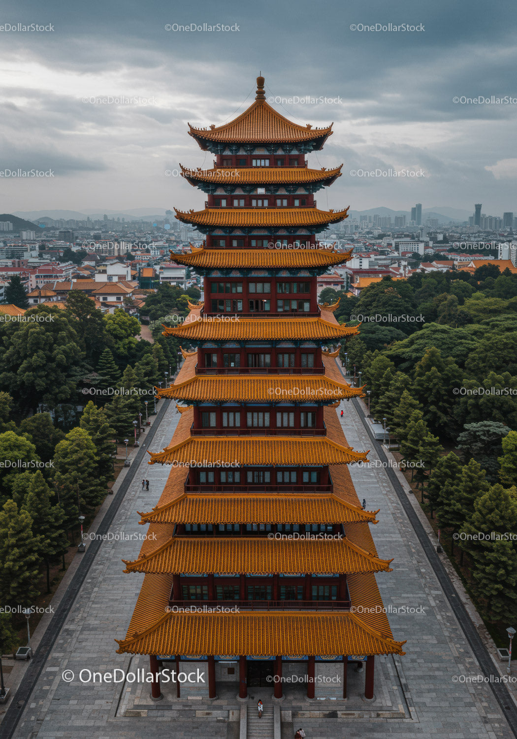 Traditional Chinese Pagoda Tower with Cityscape and Mountain View