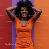 Joyful Woman in Bright Orange Dress with Curly Hair Against Colorful Background