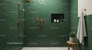 Modern shower with green scalloped tiles and brass fixtures