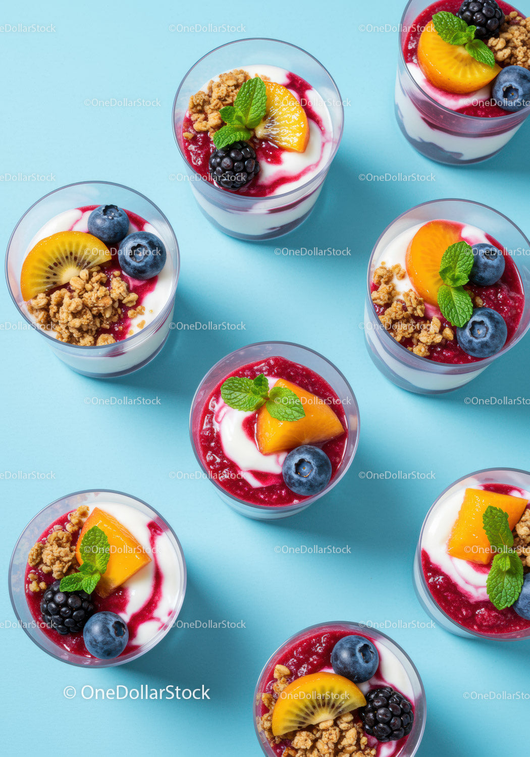 Fresh berry and yogurt parfaits with granola and fruit