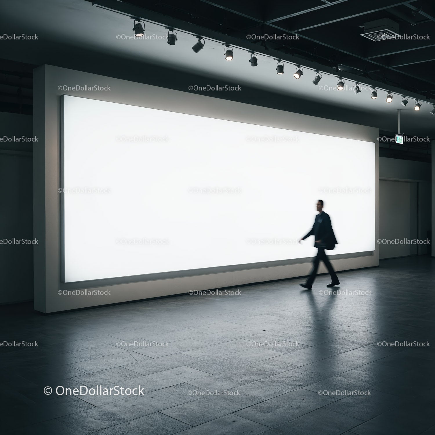 Businessman walking past large illuminated advertisement panel