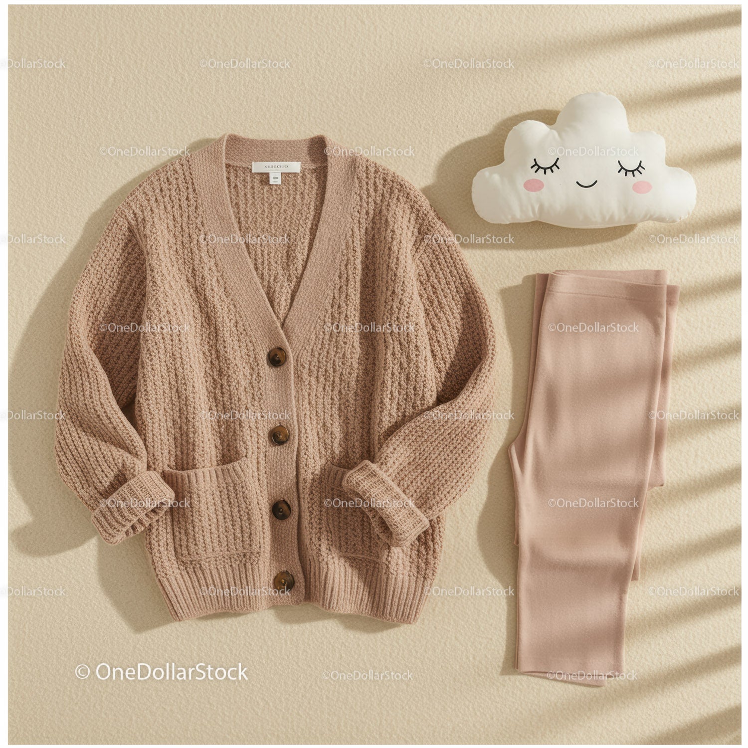 Cozy knitted cardigan and soft leggings with cute pillow