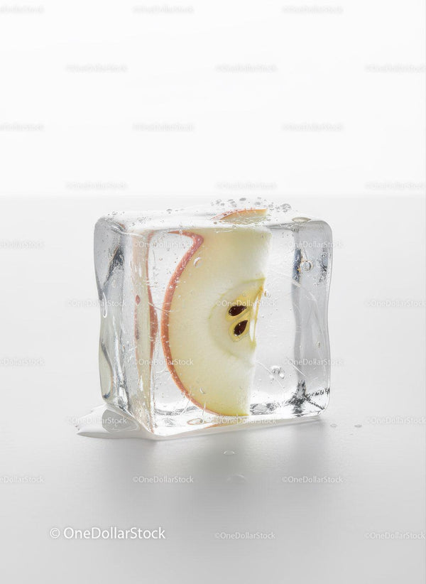 Fresh Apple Slice Captured Inside Melting Ice Cube