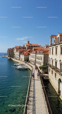 Charming Coastal Town with Historic Buildings and Waterfront Promenade