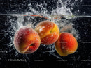 Fresh Apples Splashing into Water Creating Juicy Action