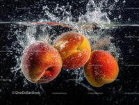 Fresh Apples Splashing into Water Creating Juicy Action