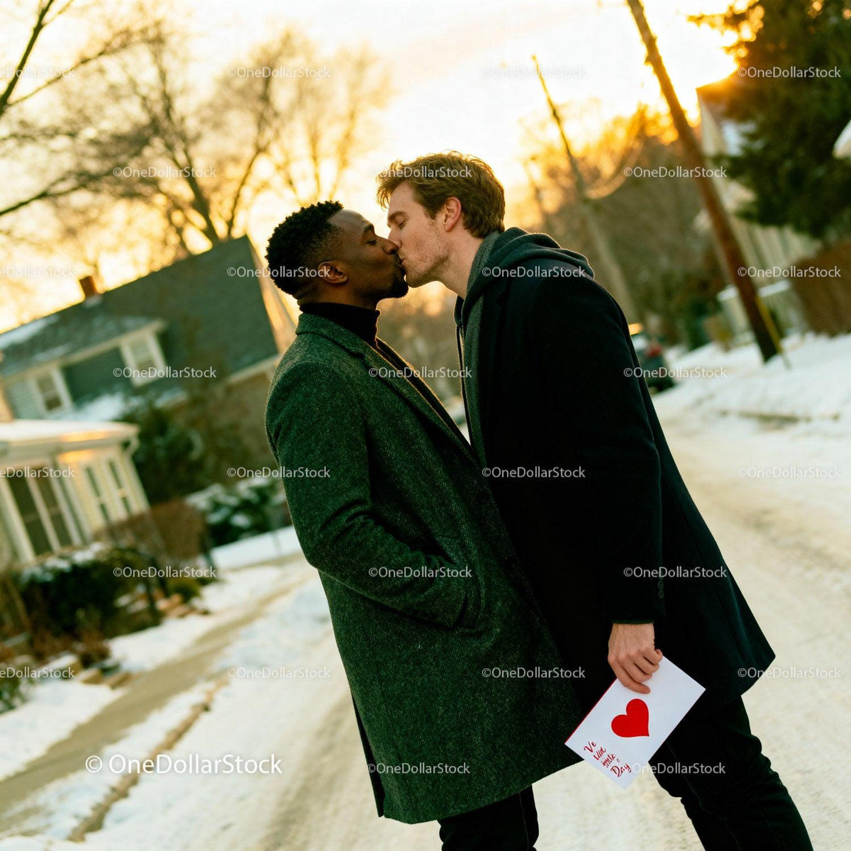 Romantic winter kiss between two men with Valentine card