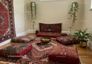 Cozy meditation space with cushions and decorative rugs