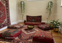 Cozy meditation space with cushions and decorative rugs