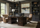 Elegant home office with classic wooden desk and leather chairs