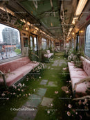 Indoor Floral Oasis in Vintage Style Train with Greenery and Pink Seats