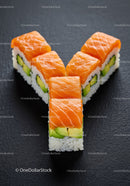 Salmon and avocado sushi rolls arranged in Y shape
