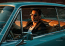 Vintage Classic Car with a Stylish Man at Sunset