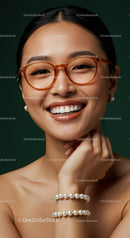 Smiling woman wearing glasses and pearl jewelry