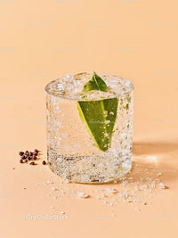 Refreshing Sparkling Water with Green Leaf and Ice Cubes