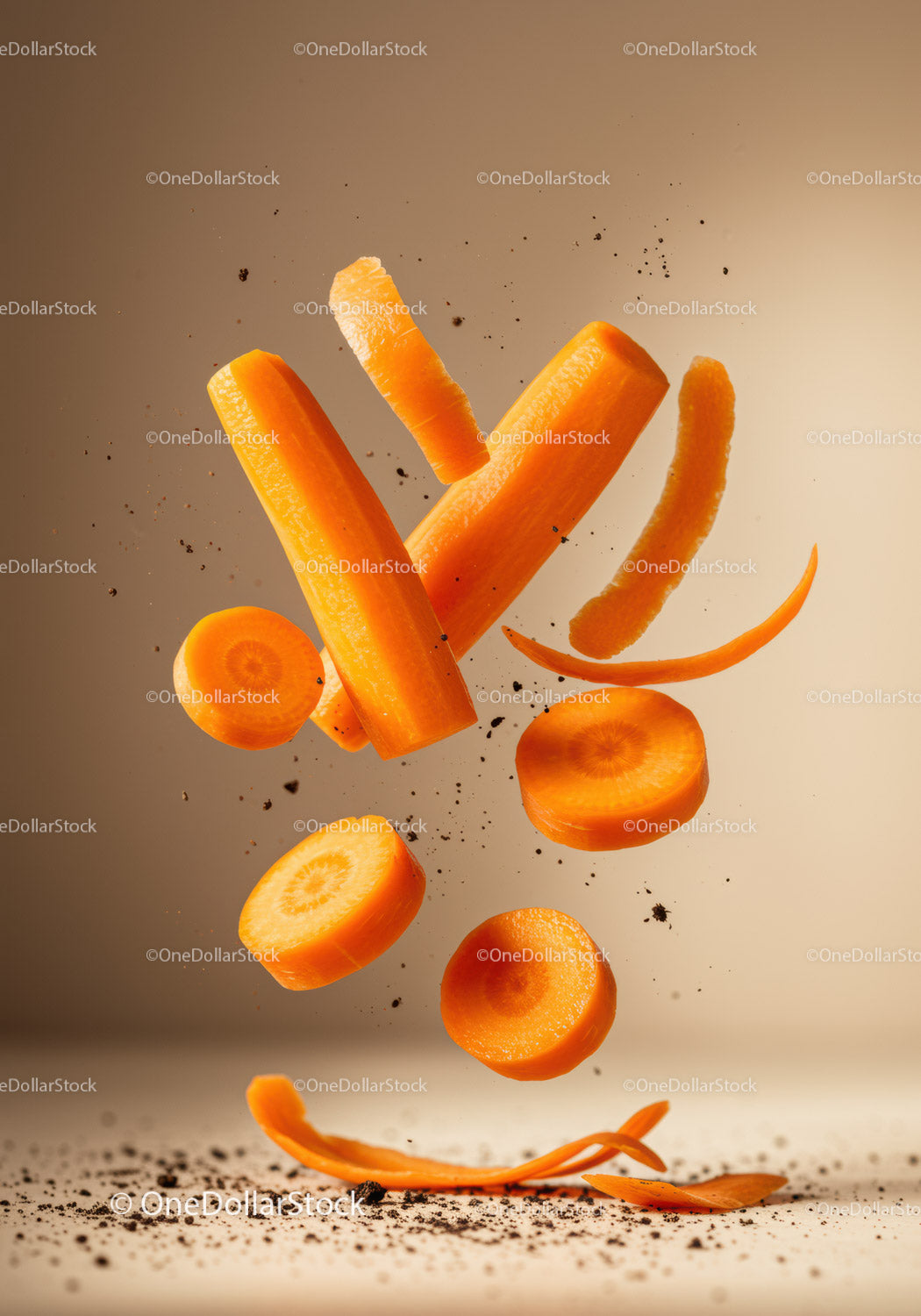 Fresh carrot pieces and peels flying with soil particles
