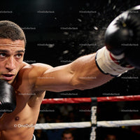 Focused boxer delivering a powerful punch in ring
