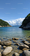 Scenic Mountain Lake with Rocky Shore and Lush Green Trees