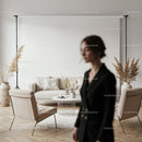 Modern living room with beige decor and blurred woman