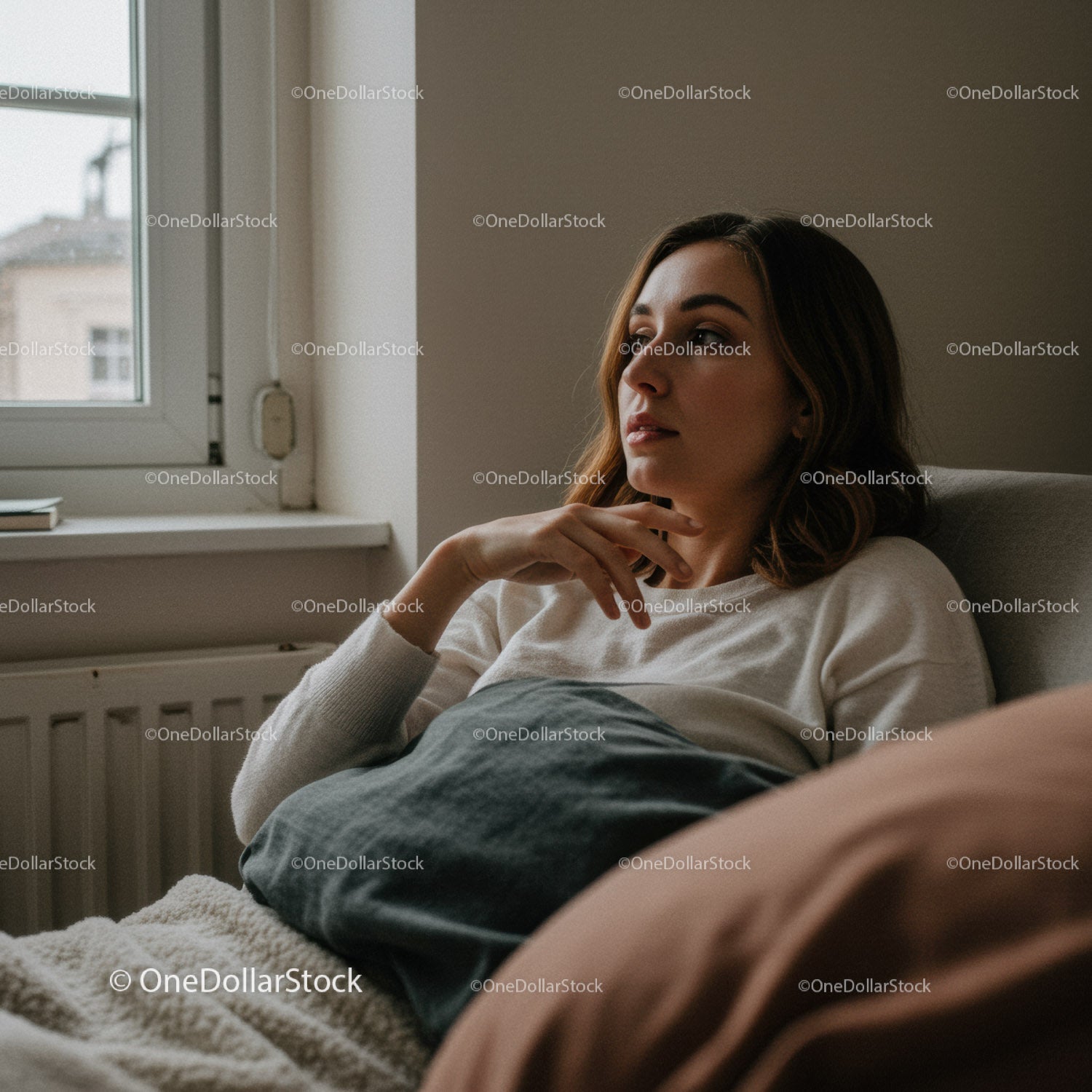 Relaxed Woman Sitting on Bed Near Window in Natural Light