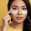 Young Woman with Under-Eye Patches Applying Skincare Treatment