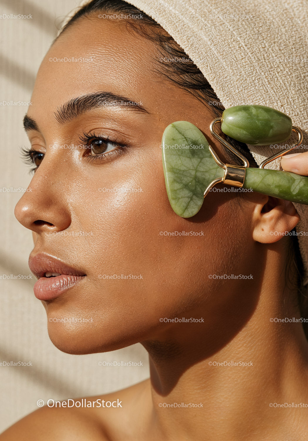 Close-up of a Woman Receiving Facial Massage with Jade Roller for Skin Glow