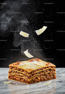 Freshly baked lasagna with falling cheese slices