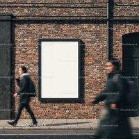 Urban street scene with blank billboard on brick wall
