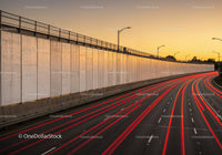 Urban Highway with Light Trails at Sunset
