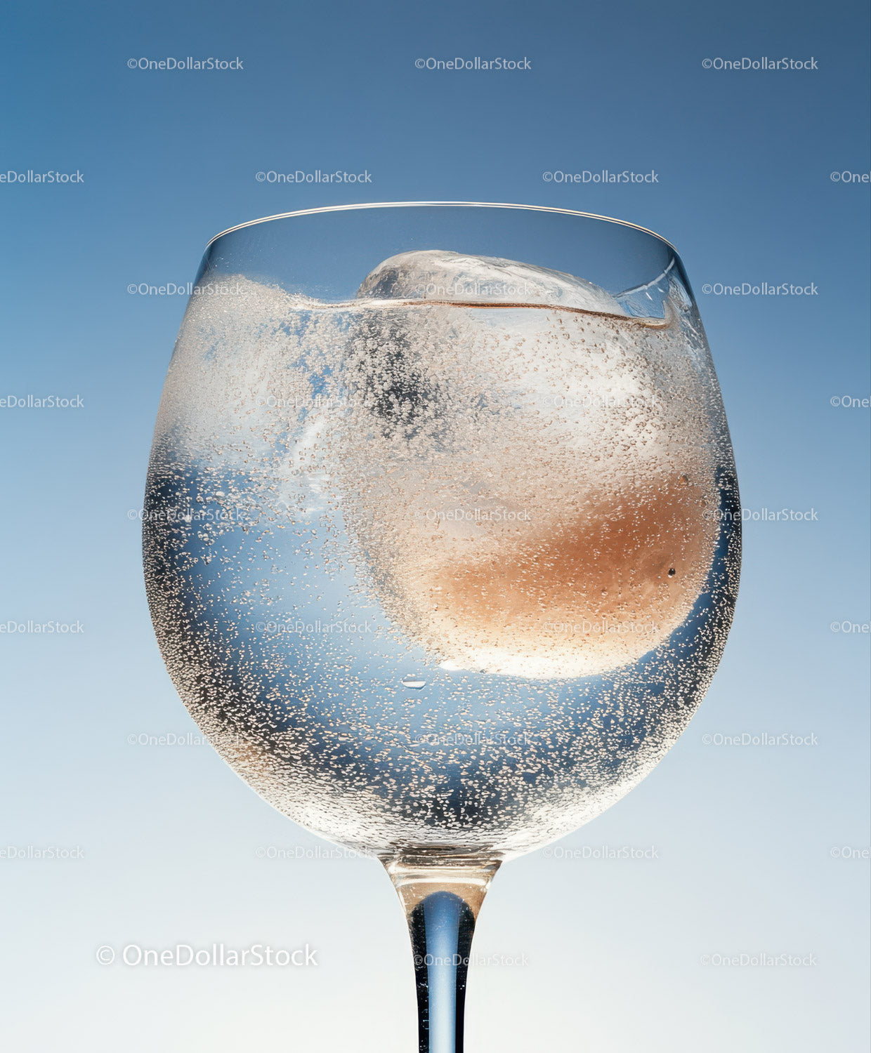 Chilled Sparkling Drink in Elegant Champagne Glass with Ice