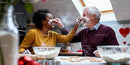 Couple Enjoying Playful Baking Moment in Cozy Kitchen