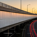 Urban Overpass with Sunset Sky and Light Trails