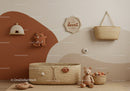 Cozy Baby Nursery Decor with Woven Baskets and Plush Toys