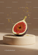 Fresh fig half with golden droplets on stone pedestal