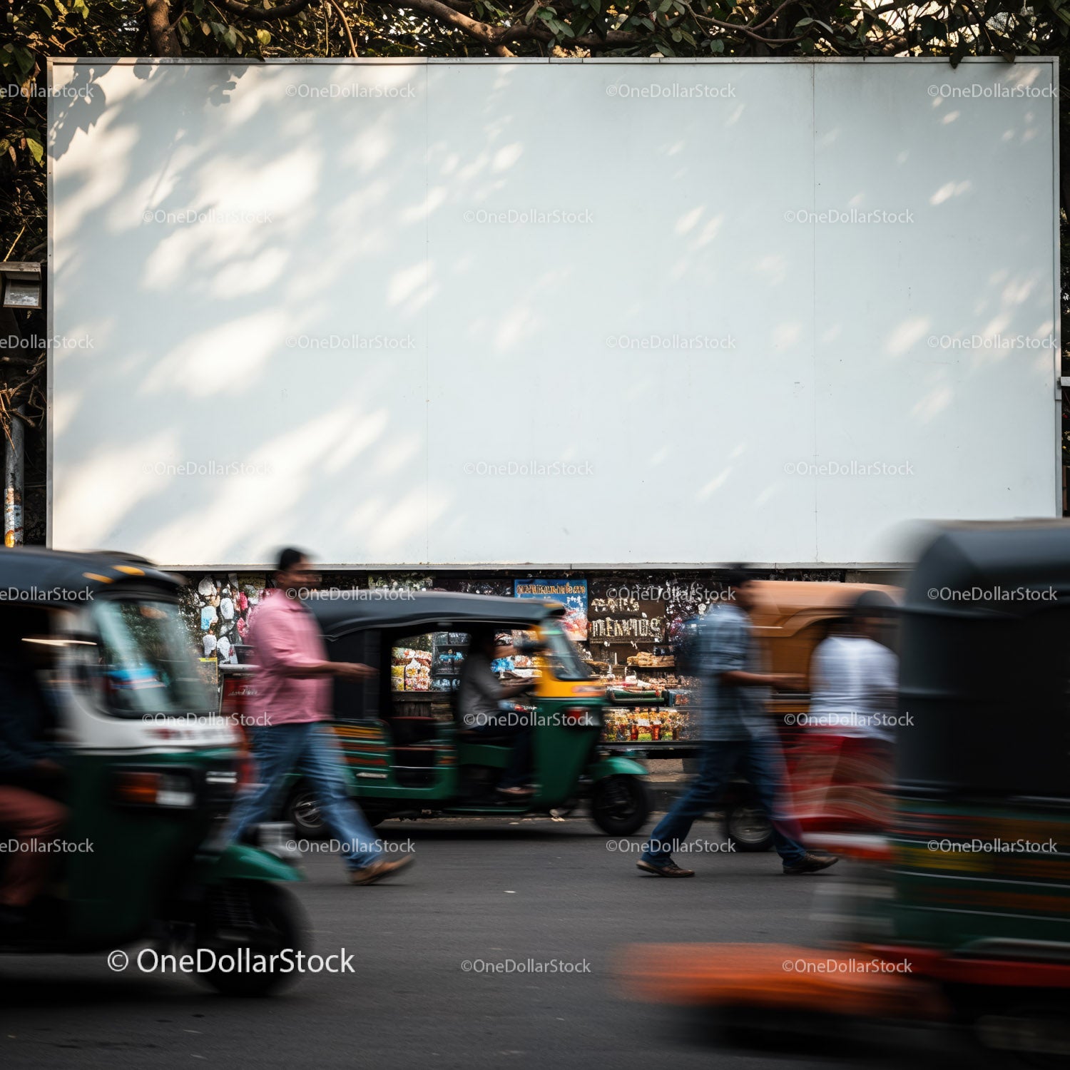 Busy street with auto rickshaws and pedestrians crossing