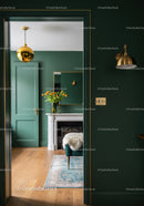 Elegant Emerald Green Interior with Gold Accents and Cozy Fireplace